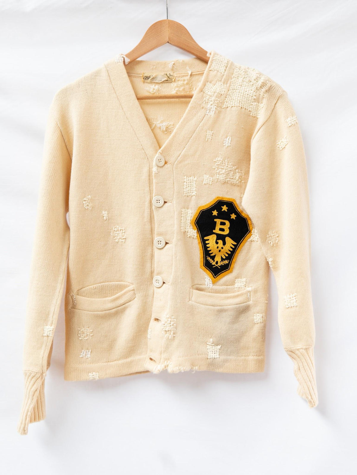 Cream Distressed Letterman Cardigan — garment photograph 1
