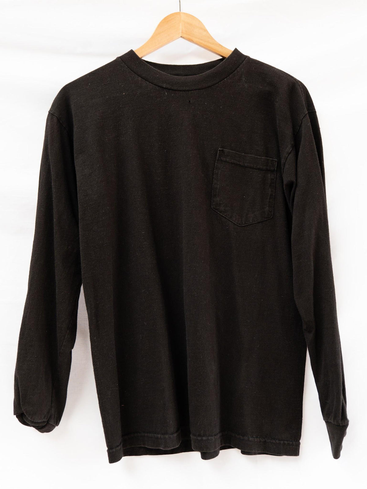 Black Long Sleeve Pocket T-Shirt — garment photograph 1