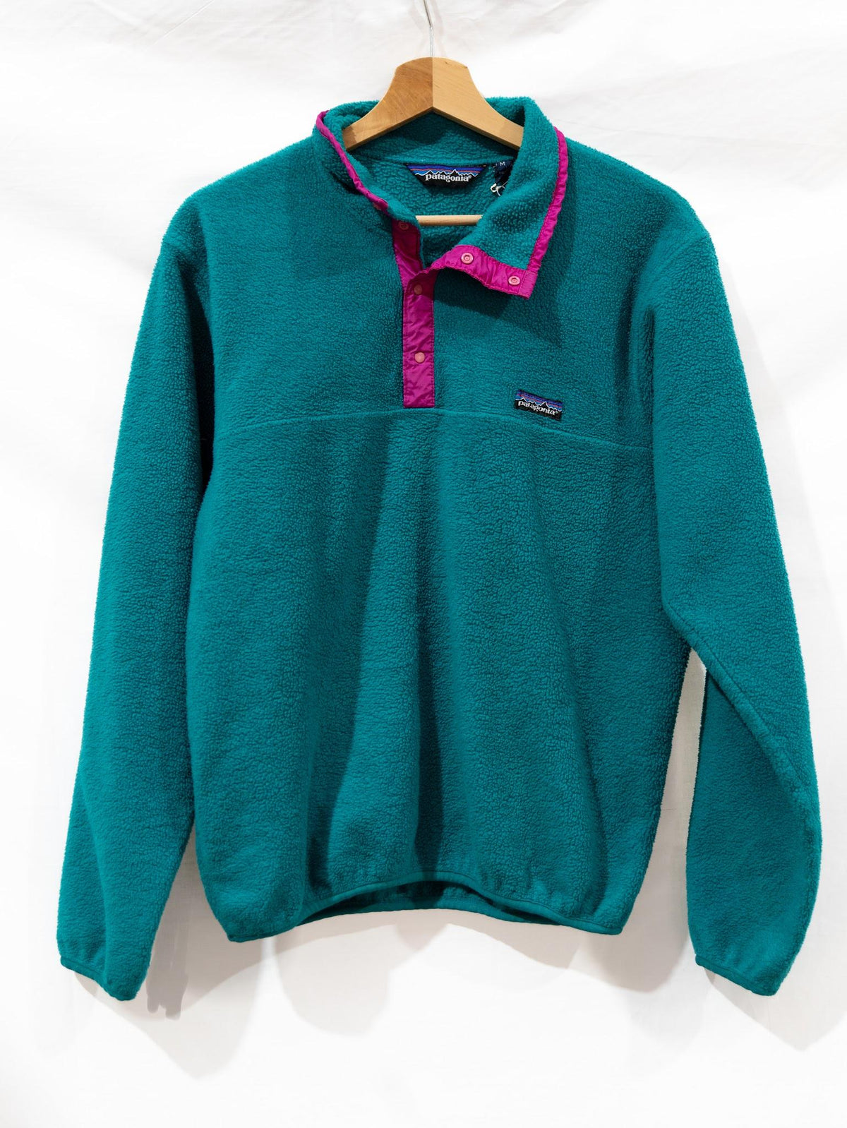 Teal Half-Zip Fleece with Pink Trim — garment photograph 1